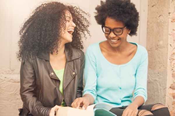 Two friends enjoying a laugh