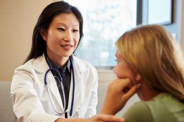 a woman seeing her physician for ADHD diagnosis