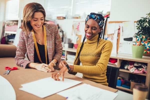 Two women working together