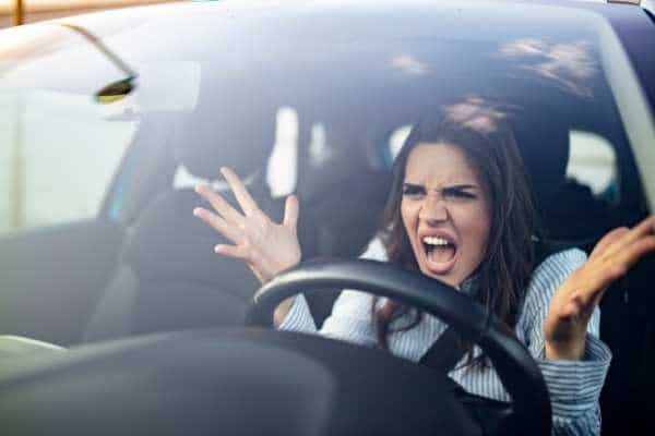woman in car upset with other drivers