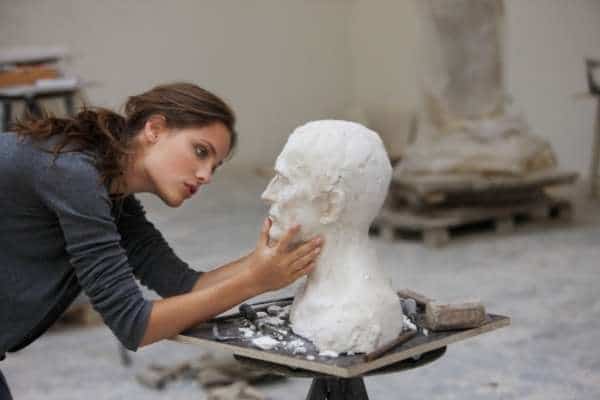 artist sculpting a bust