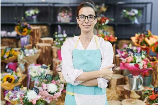 a female entrepreneur in front of her floral business