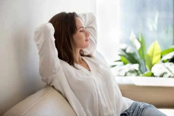 relaxed woman sitting on a couch