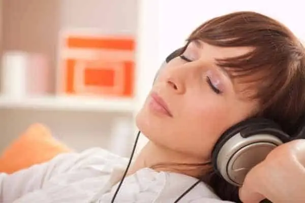 woman looking relaxed wearing headphones