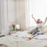 woman waking up refreshed