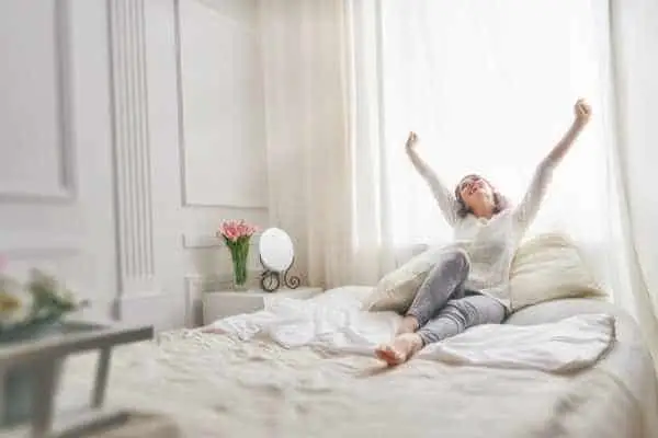 woman waking up refreshed