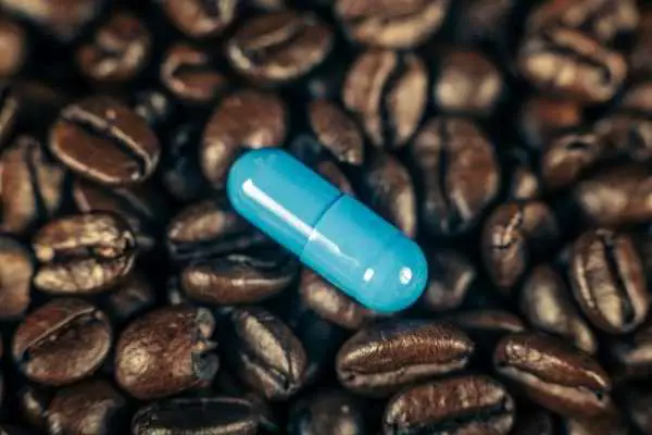coffee beans and ADHD medication capsule