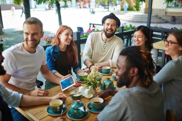 Happy group of friends at a coffee shop