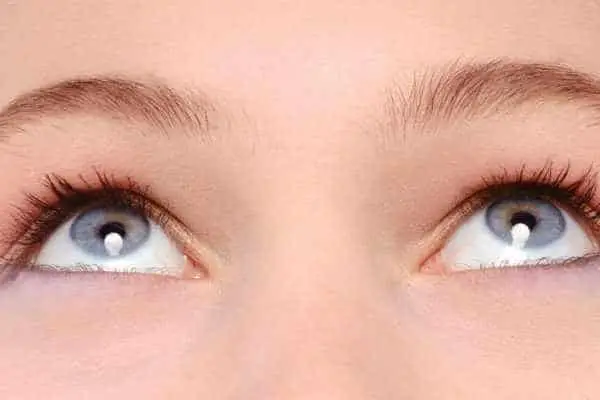close up of a woman's eyes while she looks up