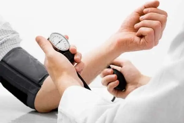 Health care provider taking a patient's blood pressure
