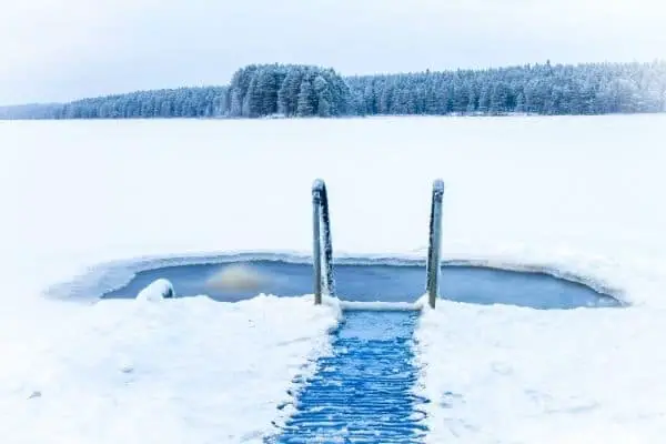 Frozen lake with a hole for cold water immersion
