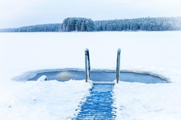 Frozen lake with a hole for cold water immersion