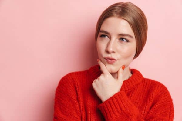 Woman chewing her cheek